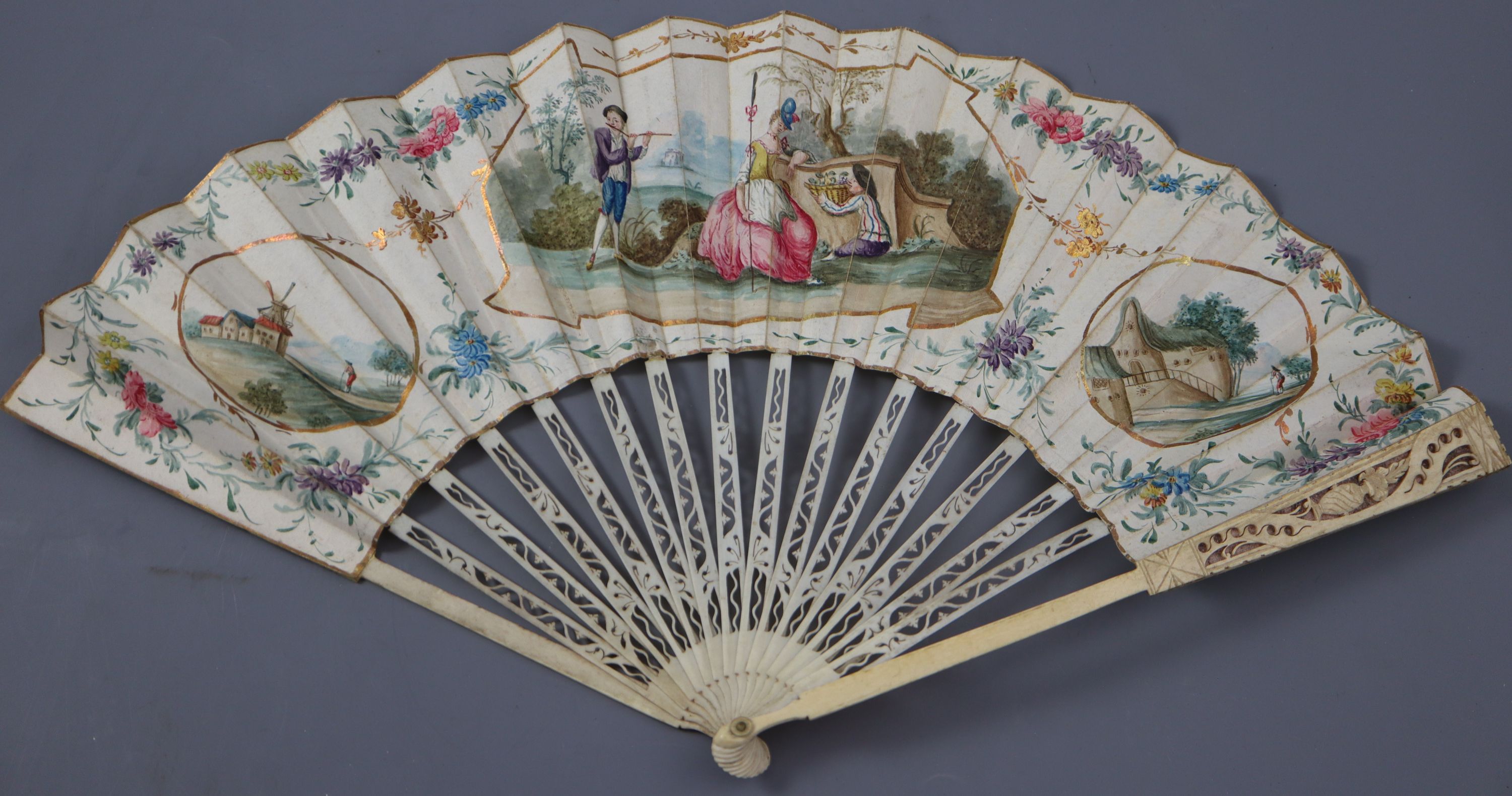 An early 19th century English bone, ivory and chicken skin fan and an Oskar Zeibig fan